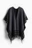Poncho con borde de flecos
