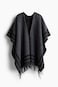 Poncho con borde de flecos